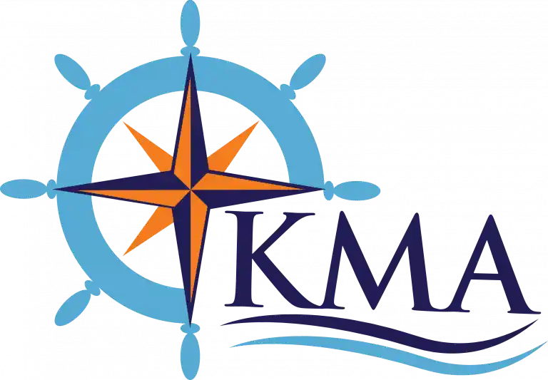 Blue ship steering wheel with an orange and blue compass star in the center, and the letters KMA next to it with wavy lines underneath.
